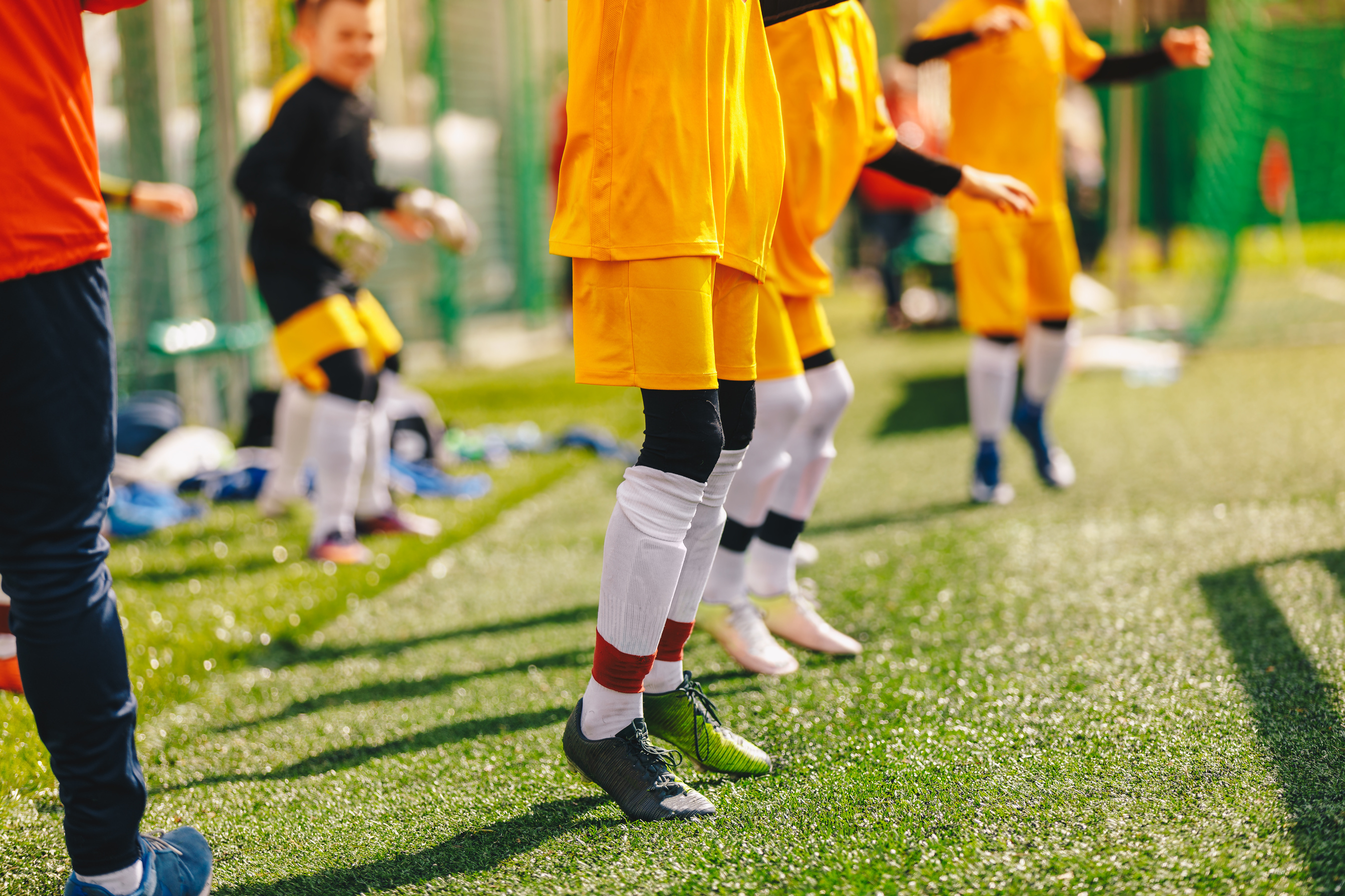 Children Jumping During Soccer Training